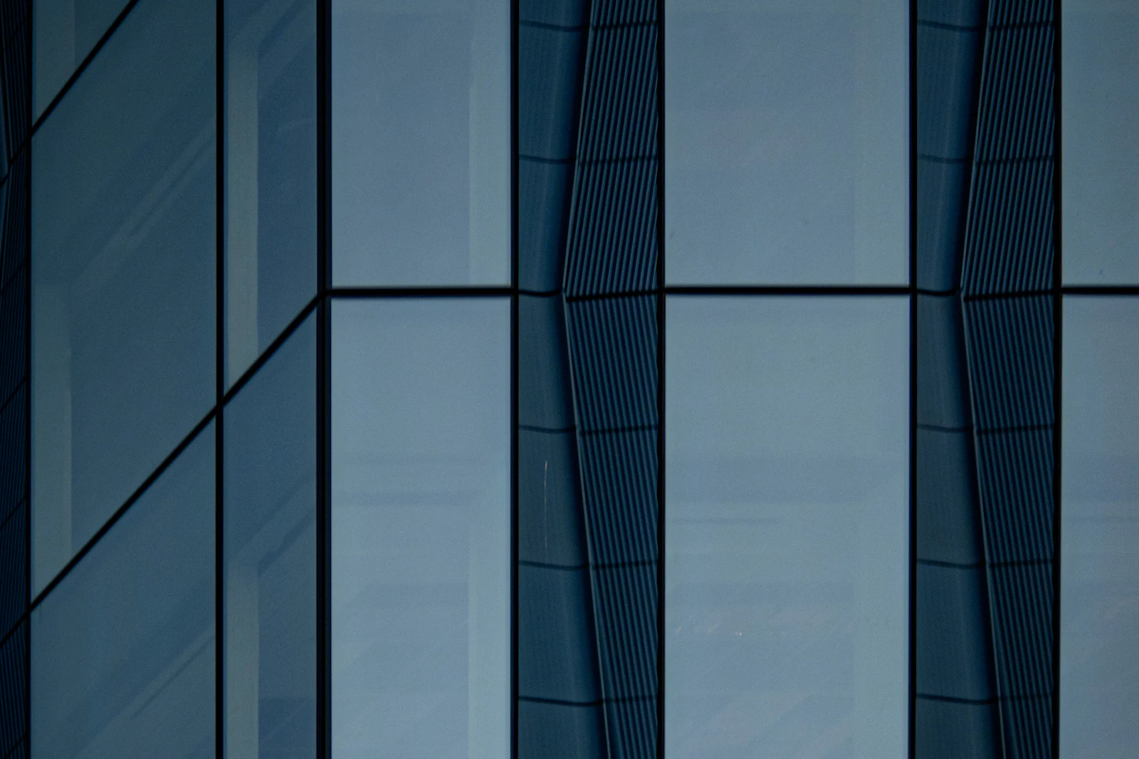 A grey-blue glass façade